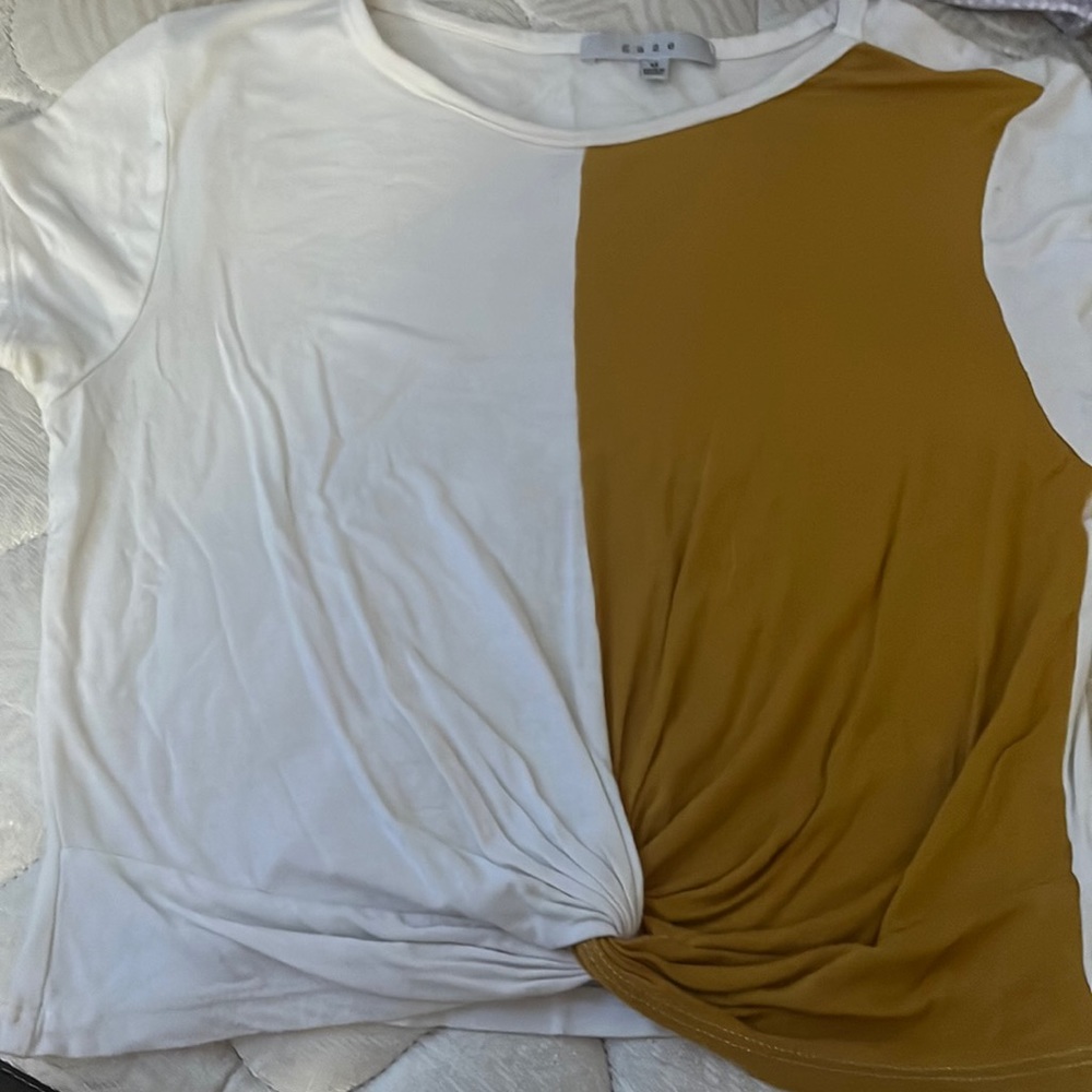 white and mustard yellow crossed at the bottom crop top